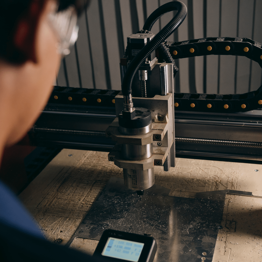 CNC machine repair services UK: A Midland Oil Group engineer repairing a CNC machine