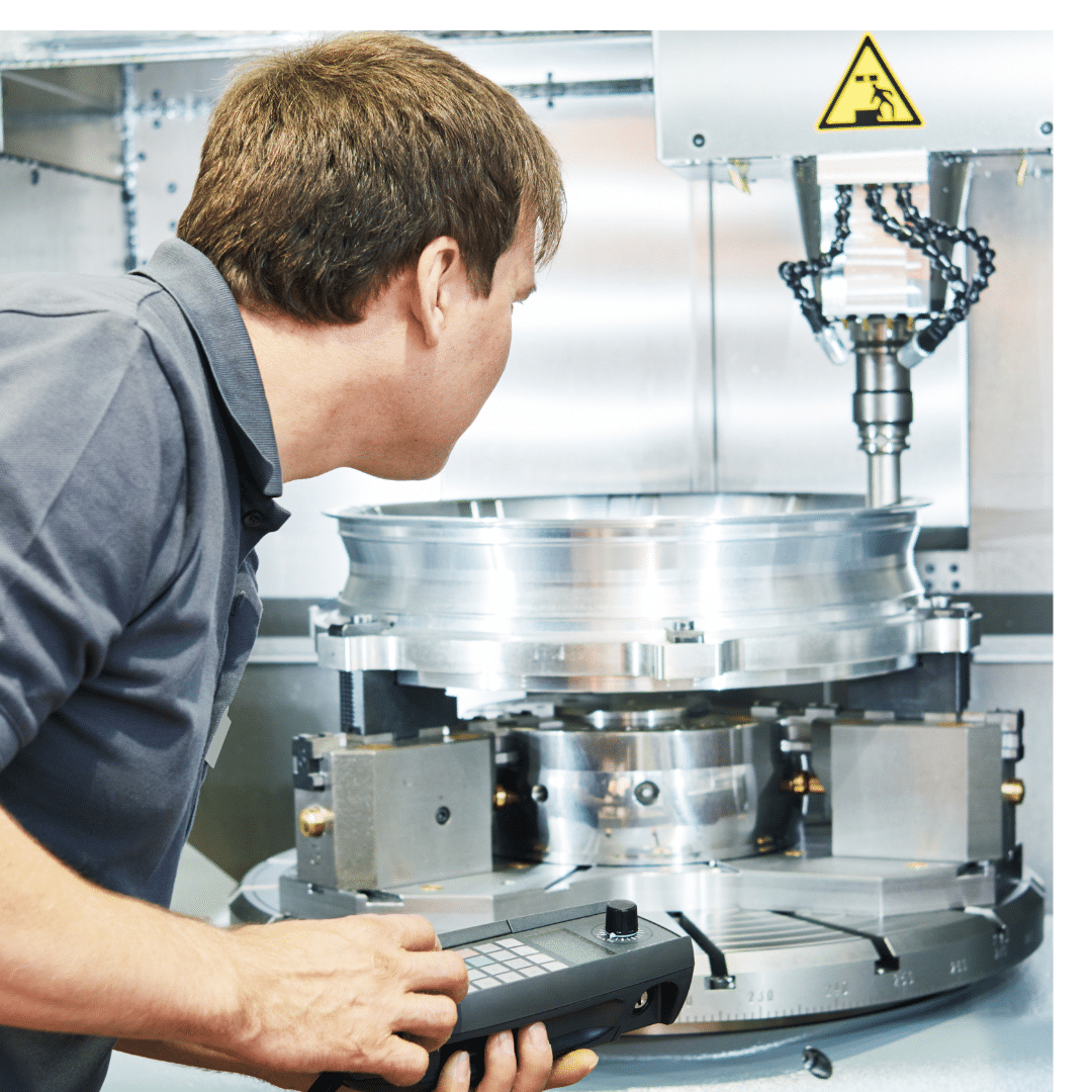 CNC machine repair services UK: A Midland Oil Group engineer repairing a metal precision CNC machine